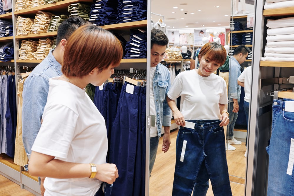 asian-woman-choosing-jeans-shop